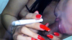 indonesian babe giving bj while smoking